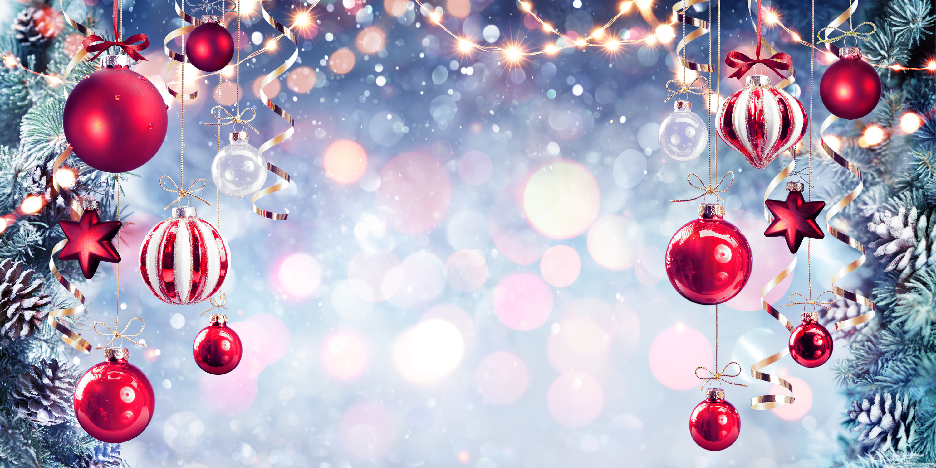 Christmas - Red Baubles Hanging With Fir Branches In Shiny Background